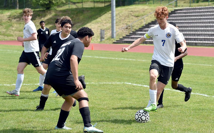 Brussels midfielder Cade Wedekind tries to dribble around Baumholder center back Aziz Kurt inside the 18-yard box during a May 4, 2024, match at Minick Field in Baumholder, Germany.