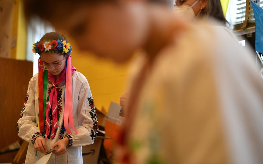 Melania Kolcio, 15, from McClain, Va., rolls 5-foot-long pieces of duct tape around a piece of cardboard for the medical kits. Duct tape can be used for wound compression and potentially save a life in a war zone. 