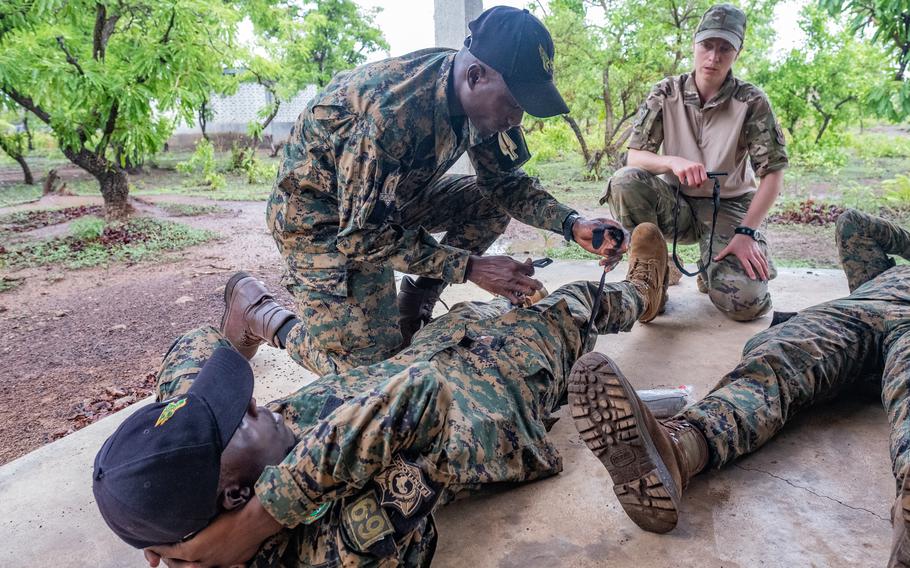 U.S. Air Force Maj. Chantul Fischer, a nurse assigned to the 193rd Special Operations Medical Group, oversees members of Ghana's armed forces May 13, 2024, as they show how to apply a tourniquet during exercise Flintlock 24 in Daboya, Ghana.