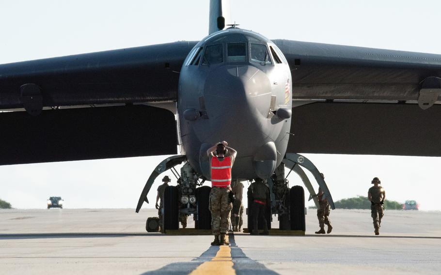 Airmen prepare a B-52 bomber for maintenance on the flight line in support of a bomber task force deployment at Andersen Air Force Base, Guam, Feb. 9, 2022. 