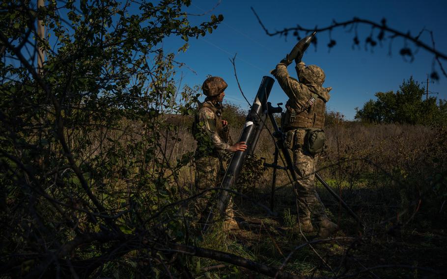 Ukrainian troops firing mortar a Russian position near Bakhmut on Oct. 16. 