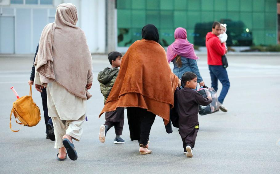 Afghans evacuated by the U.S. arrive at Pristina International Airport in Kosovo in October 2021. A total of 16 Afghan evacuees at Camp Bondsteel were turned down in their bid for admission to the U.S., government officials and media reports said.  