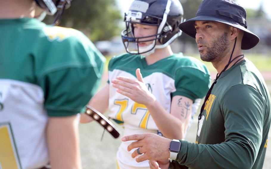 Marcus Thomas, right, is in his second season as Edgren head football coach.