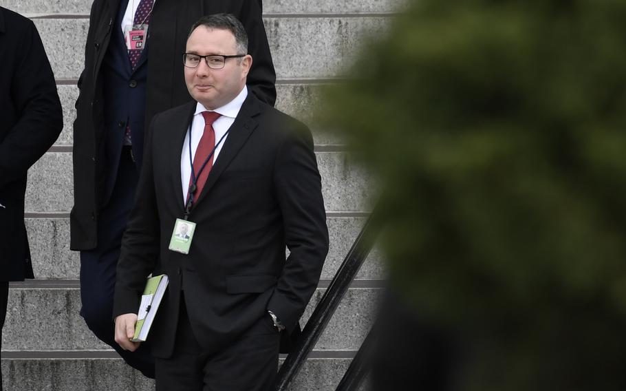 In this Jan. 27, 2020, file photo Army Lt. Col. Alexander Vindman, a military officer at the National Security Council who testified during the impeachment hearings on Capitol Hill, walks down the steps of the Eisenhower Executive Office Building on the White House complex in Washington. Vindman who was a pivotal witness in the first impeachment case against Donald Trump has sued the oldest son of the former president and other Trump allies, accusing them of participating in an “intentional, concerted campaign of unlawful intimidation and harassment” over his decision to testify. The suit from Vindman was filed Wednesday, Feb. 2, 2022, in federal court in Washington. 