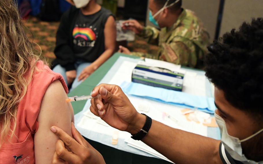 Civilian Defense Department employees receive a COVID-19 vaccine at Osan Air Base, South Korea, March 12, 2021. 