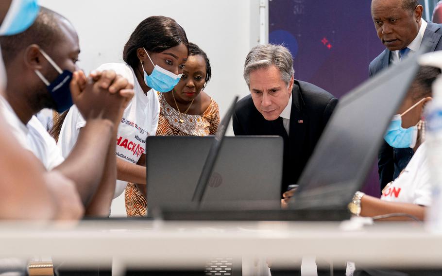 U.S. Secretary of State Antony Blinken, second from right, visits an election transparency hackathon event at the Kinshasa Digital Academy in Kinshasa, Congo, on Wednesday, Aug. 10, 2022.  