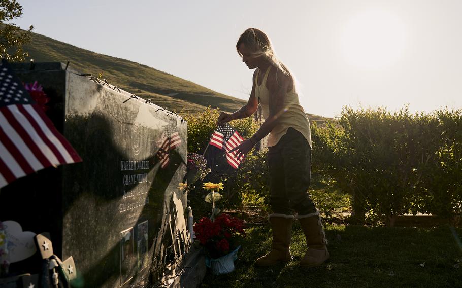 Shana Chappell visits the grave of her son, Marine Lance Cpl. Kareem Nikoui, in Riverside, Calif. He was one of 13 U.S. service members killed in a suicide bombing in Kabul in August. 