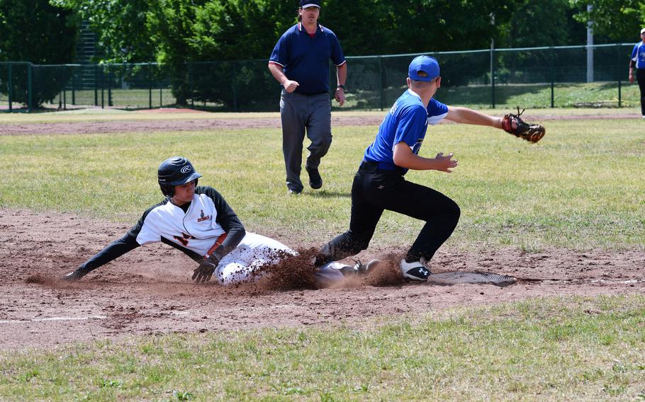 Spangdahlem's Nate Johnson slides into third after a passed ball against the Hohenfels Tigers during an elimination game on Friday, May 20, 2022, at the 2022 DODEA-Europe baseball championships.