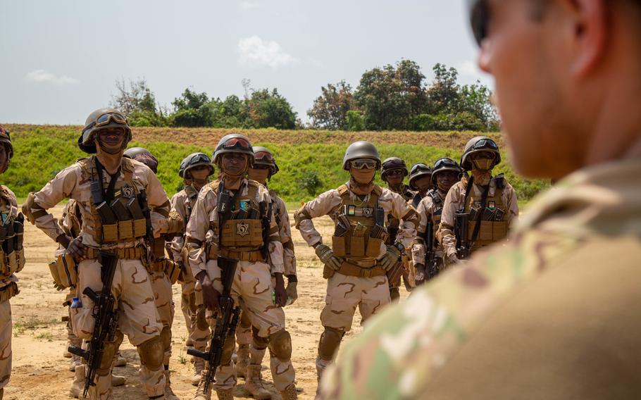 A service member briefs Niger special operations soldiers on range procedures near Abidjan, Ivory Coast, while participating in Exercise Flintlock, March 2, 2023. A recent Rand Corp. report questioned the efficacy and risks of military aid in countries with fragile political institutions.
