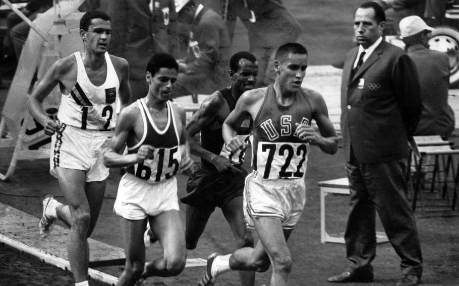 Billy Mills, a U.S. Marine, leads the pack near the 9,000-meter mark during the 10,000-meter run at the Tokyo Olympics in 1964. 