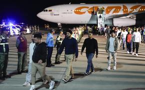 Venezuelan migrants deported from the United States arrive at Simon Bolivar International Airport in Maiquetia, Venezuela, Monday, March 24, 2025. (AP Photo/Ariana Cubillos)