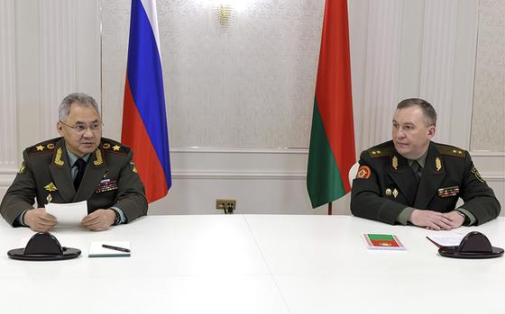 Russian Defense Minister Sergei Shoigu, left, and Belarusian Defense Minister Viktor Khrenin speak to the media after a session of the Council of Defense Ministers of the Collective Security Treaty Organization (CSTO) in Minsk, Belarus, Thursday, May 25, 2023. (Vadim Savitsky/Russian Defense Ministry Press Service via AP)