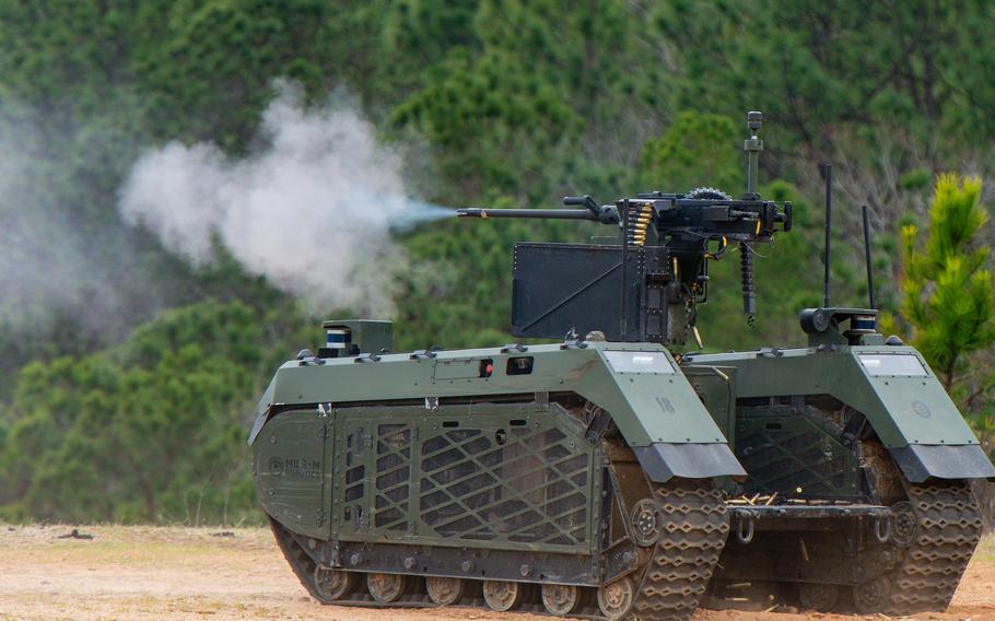 THeMIS, an uncrewed ground vehicle from the Dutch military, fires a .50-caliber machine gun during an Army Expeditionary Warfare Experiment demonstration of robotics capabilities in an infantry platoon on Tuesday, Feb. 27, 2024, at Fort Moore, Ga. The experiment is testing the viability of building robotic capabilities into light infantry platoons in the future. 