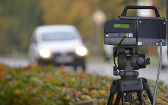 An automatic speed camera enforces the speed limit on a German roadside.