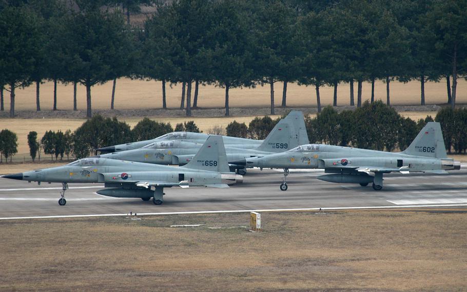 South Korean air force F-5 fighter jets shown in 2005. The F-5 has been used by many militaries, including Iran's. The U.S. this week unsealed two previously secret indictments against a network of companies that it says illegally exported military technology to Iran, including a nose landing gear assembly for the F-5.