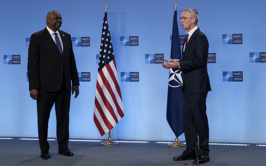 Defense Secretary Lloyd J. Austin III, left, addresses reporters with NATO Secretary-General Jens Stoltenberg before a bilateral meeting in Brussels, Oct. 13, 2022. 