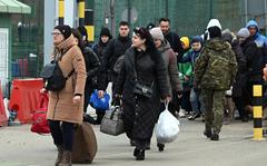 Refugees walk across the Ukrainian-Polish border at Medyka, Poland, in early March 2022. The commander of the U.S. Army garrison in Italy took to social media to warn DOD-affiliated Americans there to think twice about hosting Ukrainian refugees, citing legal issues and risks.