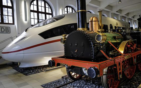 The Adler, or Eagle, the first commercial steam locomotive to roll through Germany, stands next to a high-speed Intercity Express train at the German Railway Museum in Nuremberg. Imported from England, the Adler transported passengers and cargo and reached a maximum speed of 40 mph.