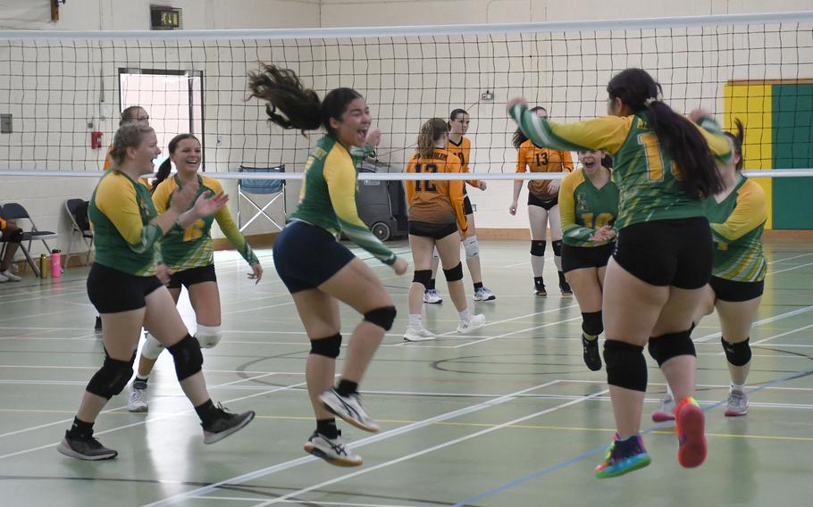 The Alconbury Dragons celebrate winning a set after Kalila Te'o  scored seven straight points as the server against the Spangdahlem Sentinels.  