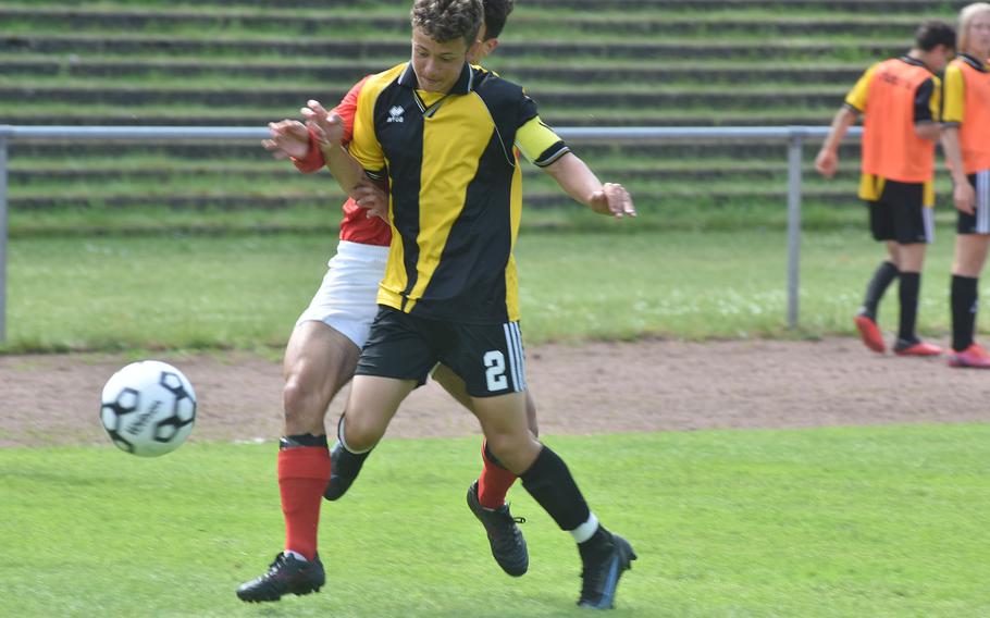 Vicenza's Conner Gundersen seals off an American Overseas School of Rome attacker on Tuesday, May 17, 2022, at the DODEA-Europe boys Division II soccer championships at Landstuhl, Germany.