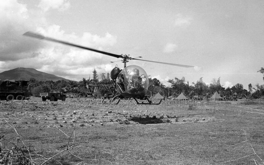A Scout H-13 helicopter takes off during Operation White Wing at Bong Son. The helos refuel, and pilots get briefed on the operation at the LZ. 