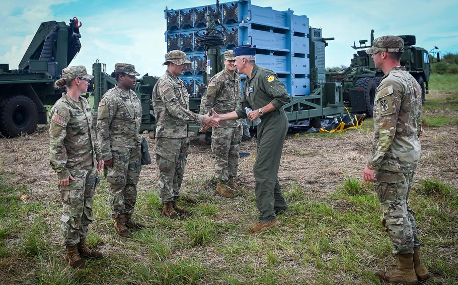 Air Force Brig. Gen. Jeremy Sloane, commander of the 36th Wing, meets soldiers assigned to the 38th Air Defense Artillery Brigade on Guam, Nov. 17, 2021. The troops were testing the Iron Dome air defense system’s ability to defend the island against cruise missiles.