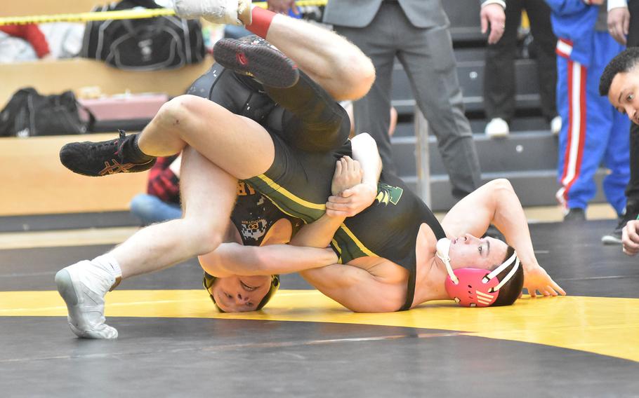 Stuttgart’s Aidan Morgan, left, defeated Alconbury’s Jacob Stuhler in a 132-pound semifinal match at the DODEA European Wrestling Championships on Saturday, Feb. 10, 2024.