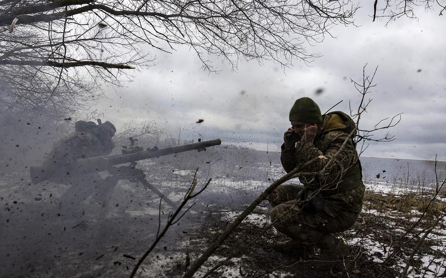 Ukrainian soldiers from the 68th Brigade fire mortars toward Russian positions in a village near the Ukrainian coal-mining city of Vuhledar on Saturday, Feb. 4, 2023.