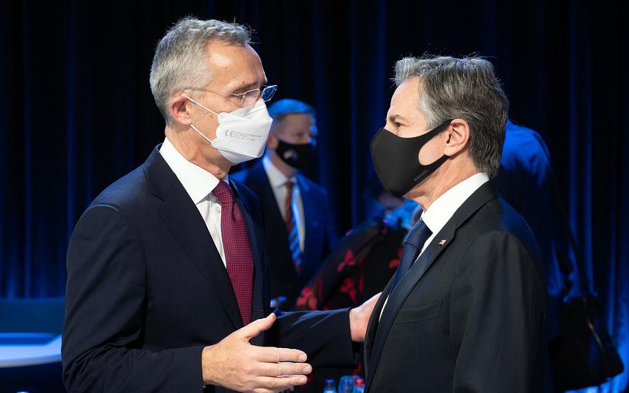 NATO Secretary-General Jens Stoltenberg, left, talks to Secretary of State Antony Blinken during the NATO foreign ministers meeting in Riga, Latvia, Dec. 1, 2021.