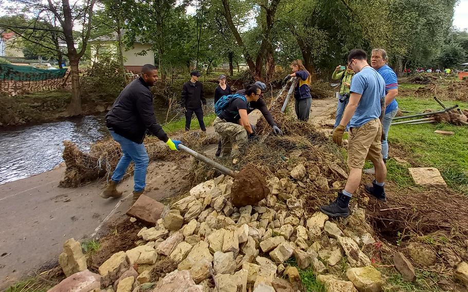 A group of volunteers help clean up the town of Rittersdorf, Germany, July 31, 2021. People from the Spangdahlem and Ramstein military communities volunteered their time following the mid-July flooding of the Nims River. 