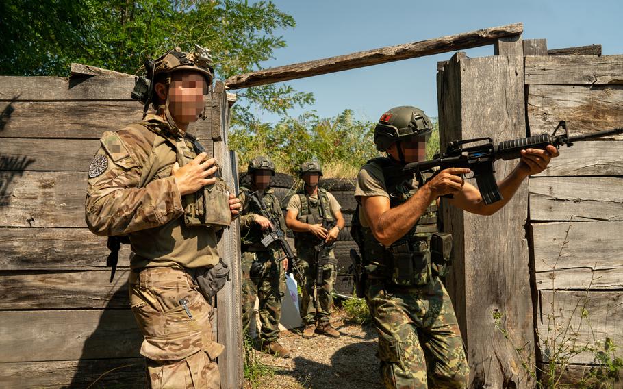 A U.S. Army Green Beret assigned to 10th Special Forces Group observes close-quarter battle drills conducted by the Albanian Special Forces, Albania, July 21, 2021. U.S. Special Operations Command Europe announced plans to locate a forward-based SOF headquarters, on a rotational basis, in Albania.