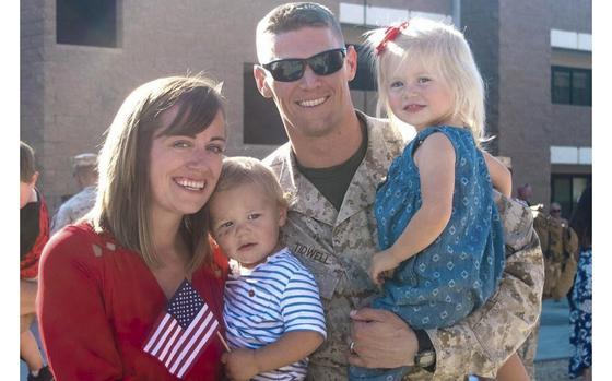 Marine Corps veteran and form Navy football player Tyler Tidwell as seen with his wife Cassi and two of their three children.