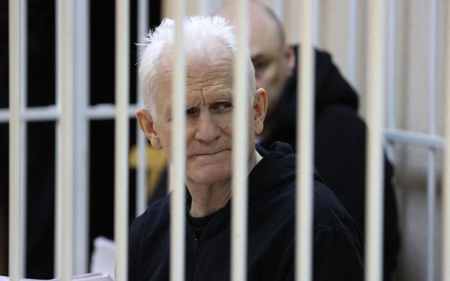Nobel Prize winner Ales Bialiatski is seen in the defendants’ cage in the courtroom at the start of the hearing in Minsk on Jan. 5, 2023. Bialiatski went on trial in Minsk in what supporters see as a bid to clamp down on Viasna, Belarus’ top rights group, which he founded.