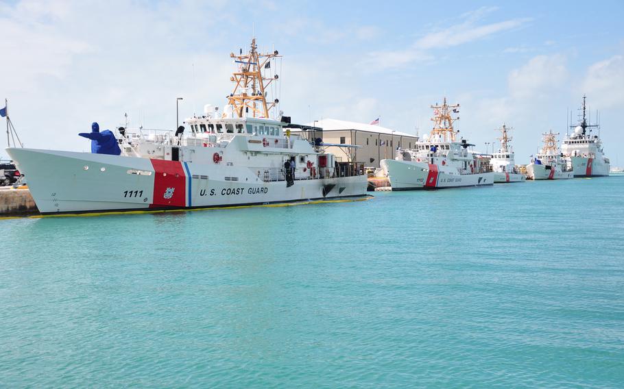 The U.S. Coast Guard rescued migrants found clinging to a partially submerged migrant vessel off the Florida Keys on Friday, Nov. 10, 2023. 