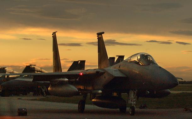 Cervia Air Base, Italy, Mar. 27, 1999: The tranquility of this twilight scene at Cervia AB, Italy, is misleading. The F-15C Eagle from the 48th Expeditionary Operations Group is preparing to leave for combat above Yugoslavia. NATO ramped up their air campaign at the end of the month. 