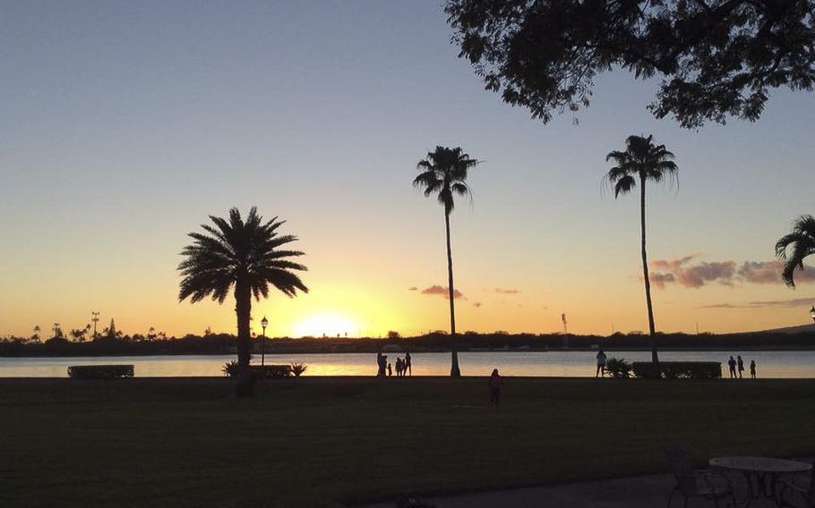 The sun sets as seen from the Hickam Air Force Base Officers Club in January 2017.