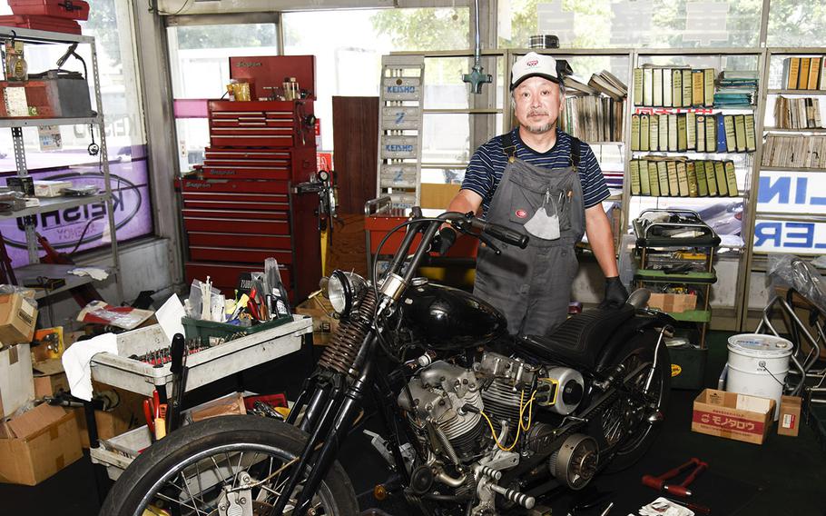 Bike Land Keisho mechanic Kenji Takagi poses at the shop across from Yokota Air Base, Japan, Tuesday, July 24, 2023.