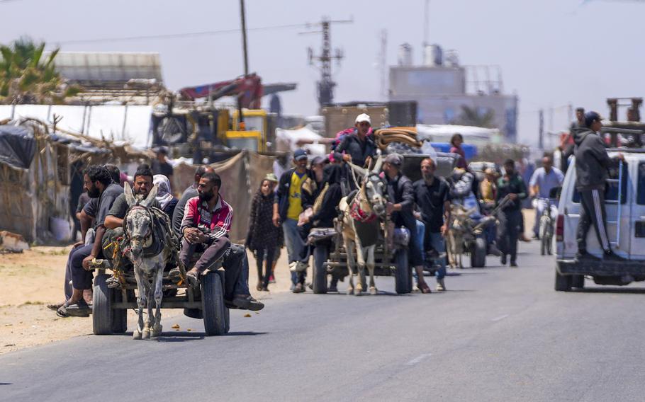 Displaced Palestinians arrive in Deir al Balah in central Gaza on May 9, 2024, after fleeing from Rafah in southern Gaza.