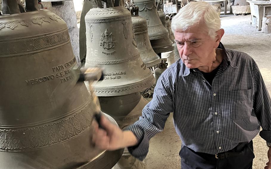 An employee at the Marinelli bell foundry in Agnone gives a demonstration. The foundry is among the oldest family-run businesses in the world and makes bells for the Vatican.