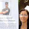 Jessica Niss poses with a photo of her son, Cpl. Eric John Niss de Jesus, at Camp Foster, Okinawa, May 24, 2023. Niss de Jesus, 24, drowned after getting caught in a rip current at Odo Beach, June 5, 2021.