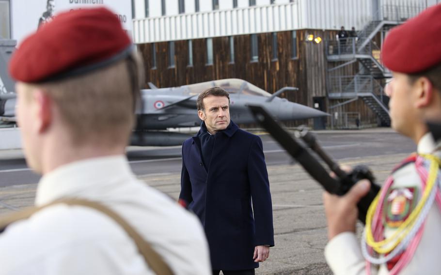 French President Emmanuel Macron reviews the troops before his New Year address to the French Army, Friday, Jan. 20, 2023 at the Mont-de-Marsan air base, southwestern France. 