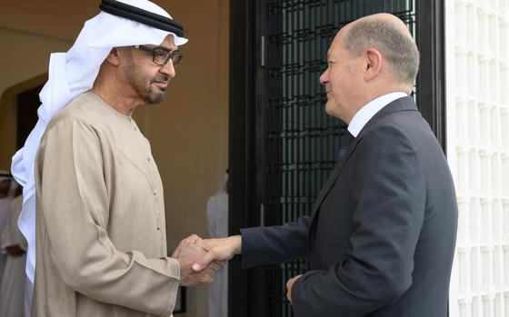 Sheikh Mohamed bin Zayed Al Nahyan, President of the UAE left, shakes hands with German Chancellor Olaf Scholz, at Al Shati Palace in Abu Dhabi, United Arab Emirates, Sunday, Sept. 25, 2022. 