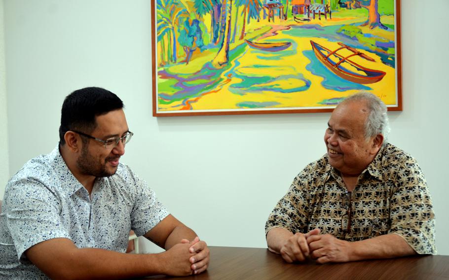 Mark Manglona, left, marketing manager for the Guam Visitors Bureau, and Gerald Perez, vice president, discuss the state of tourism, Dec. 6, 2022. 