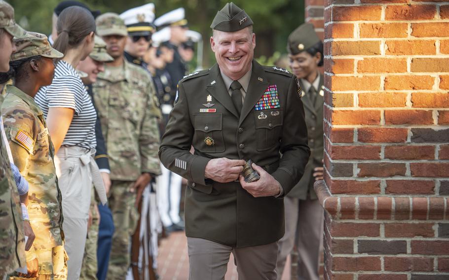 Then-Lt. Gen. Duane Gamble, Army deputy chief of staff., hands out his challenge coins to Clemson University Army ROTC cadets after a 9/11 remembrance ceremony in the university’s Military Heritage Plaza, Sept. 14, 2021. Now a major general, Gamble was demoted and removed from his deputy chief of staff for logistics job following a toxic command climate probe, the service said Wednesday, April 6, 2022.