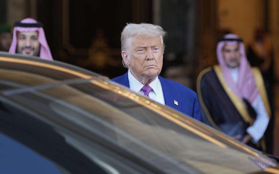 President Trump prepares to get into a car.