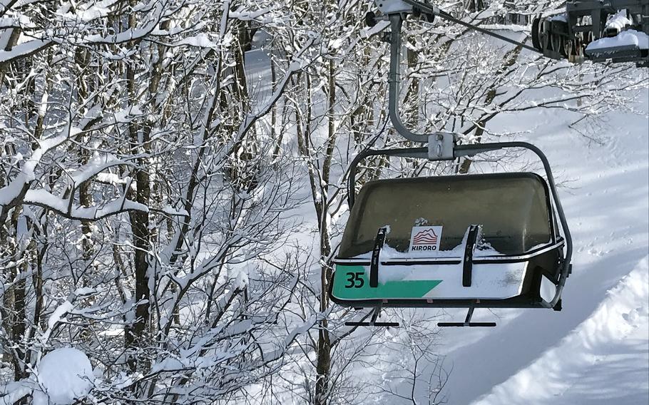 Snowy pine-covered mountains and valleys at Kiroro Resort are the perfect winter playground for skiers and snowboarders in Hokkaido, Japan.