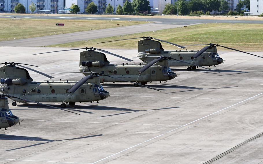 A row of Army helicopters.