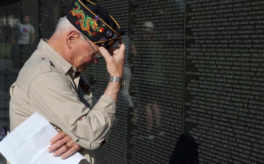 Vietnam veteran William Woodier is overcome with emotion during a Memorial Day visit to the Vietnam Veterans Memorial in Washington on Monday, May 30, 2022. Woodier, who served in Vietnam from 1967 to 1968, was remembering several friends who died in or as a result of the war, including boyhood friend David Kreis.