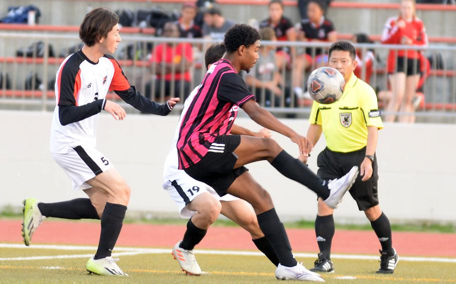 Kadena's Calvin Paguada tries to settle the ball in front of Nile C. Kinnick's Kai Tsuchiya during Friday's DODEA interdistrict boys soccer match. The Panthers won 2-0 in a rematch of last April's Far East Division I final, won by the Red Devils at Kinnick 3-2.