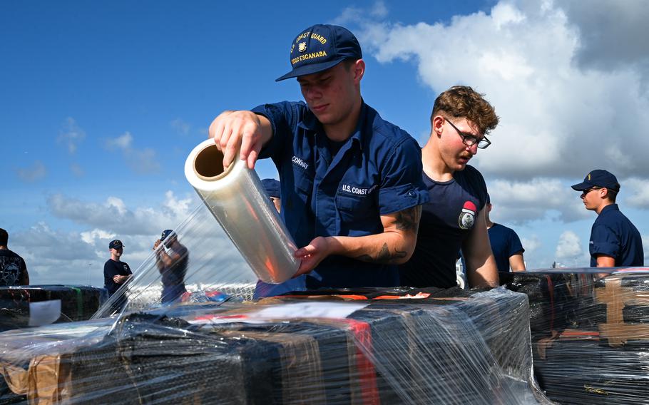 A man wrapping packages
